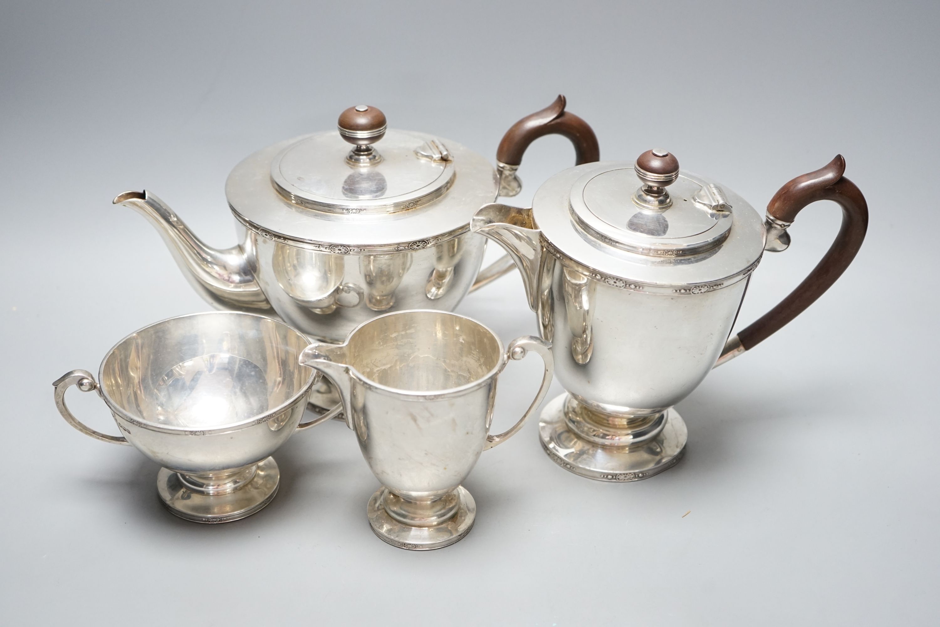 A George V silver four piece pedestal tea set, Brook & Son, Sheffield, 1926/7